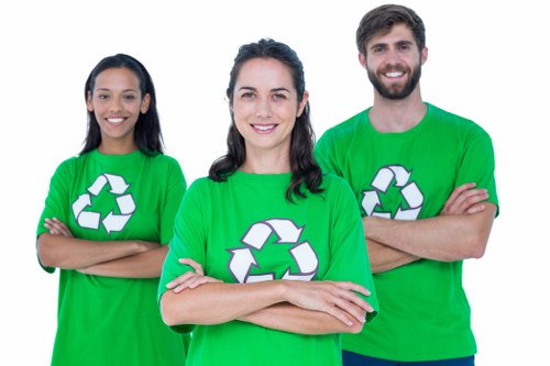 Workers handling chemical waste safely